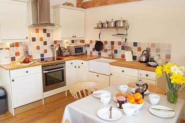 The kitchen is beautifully fitted and has a Belfast sink and woodblock work surfaces.