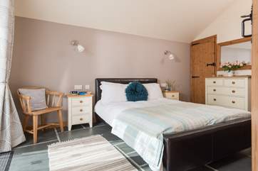 The master bedroom has lovely calming tones.