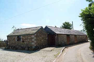 The front of the cottage, with the parking-area beside it.