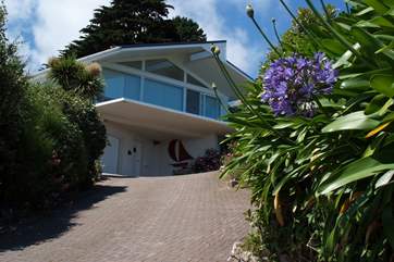 The steep drive leads up to this lovely property.