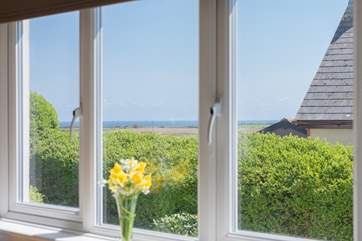The sunny, contemporary kitchen has lovely sea views.
