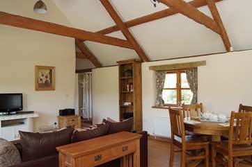 Looking from the kitchen-area across the living-room towards the entrance hall.