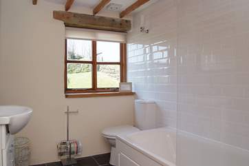 The bathroom lies between the two bedrooms.
