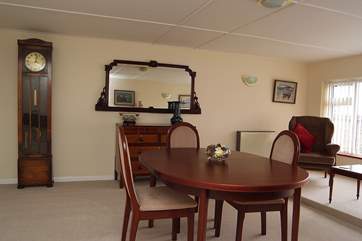 The spacious dining-room has a pleasant sitting-area.