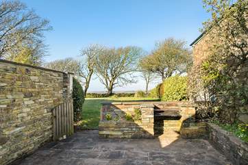 The pretty patio overlooks the garden