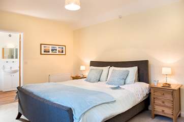 The cottage bathroom leads off from the bedroom
