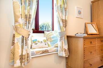 The cottage has lovely soft furnishings