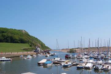 The pretty harbour at Seaton with the cliffs and sea beyond. A very short walk downhill from Little Woodlands (uphill on the way back).