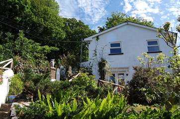 Steps lead down to Little Woodlands - the ground floor of this little detached building.