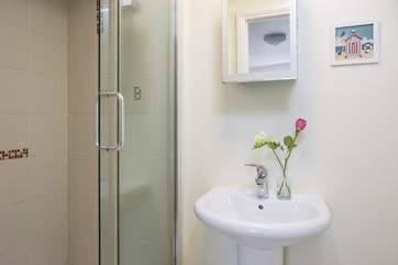 The en suite shower room has a double size shower cubicle.