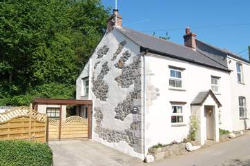 The enclosed patio garden and parking space are beside the cottage.