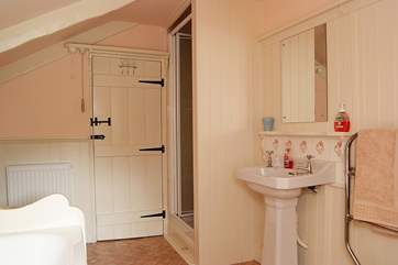 As well as a bath there is a separate shower cubicle in the bathroom.