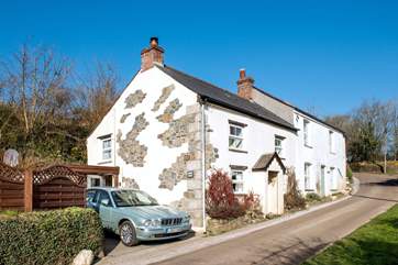 The enclosed patio garden and parking space are beside the cottage.
