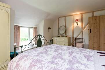 The window looks out over the gardens and the fabulous view beyond.