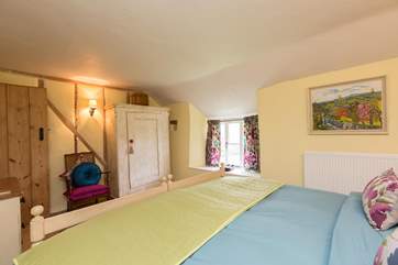 This bedroom looks out over the beautiful gardens and across the valley beyond. There is plenty of room for a travel cot should you need one.