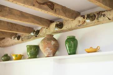The owner's passion for collecting interesting artefacts and artwork has been put to good use throughout the cottage.