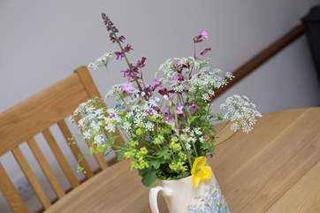 Pretty flowers on the table add welcome.