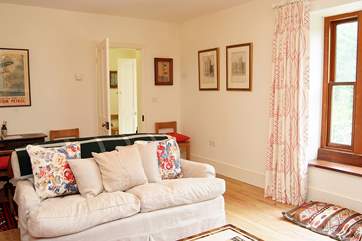 The sitting-room is light and comfortable.