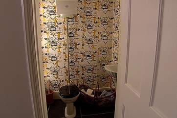 The black and gold wallpaper is designed by Kirstie.