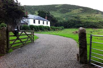Meadowgate is set down a driveway and is detached.