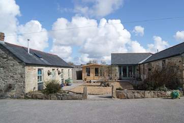 These pretty barns sit around the shared courtyard across from the Owner's home.