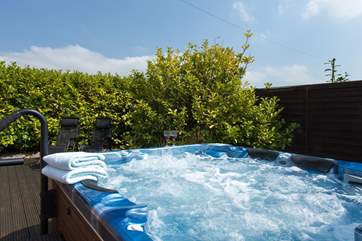 The great treat here is this lovely hot tub - in a very private side garden.