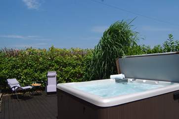 There is a fabulous, very private, supersize hot tub and a garden and patio too, both looking out over fields and country views.