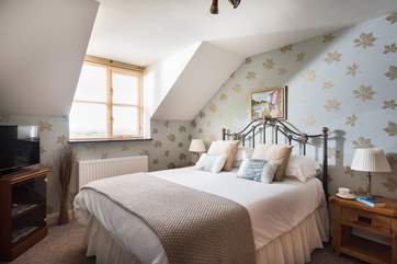 Beautiful wallpapers and soft furnishings throughout the apartment.