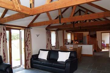 The spacious open plan living-room with comfortable seating for six.