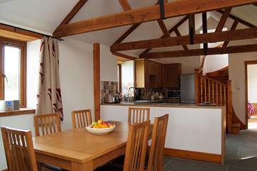 The dining-table is at the centre of the living-room.
