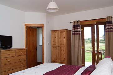 Both ground floor bedrooms have patio doors opening out to the garden.