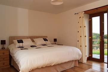Bedroom 1, on the ground floor, has 'zip and link' (double or twin) beds and a door leading out to the garden.