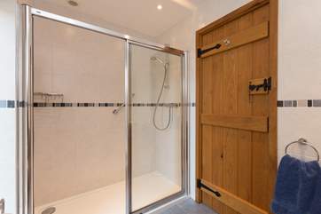 The twin bedroom has a walk-in shower with just a small lip to the tray.
