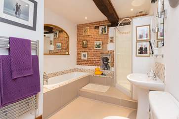 This is the main bathroom - very arty and colourful as well as being a lovely size. It has a separate shower cubicle.