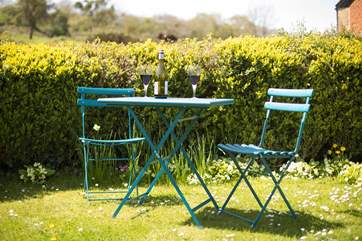 The lawned top part of the garden is a good place to sit and enjoy a drink.