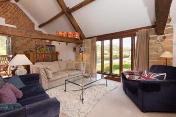 The reverse level accommodation makes the most of the views - the first floor is a lovely open plan space.