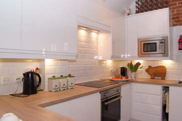 All the appliances are integrated in this lovely sleek kitchen design.