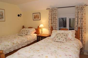The cosy twin bedroom (Bedroom 3) has dual-aspect windows.