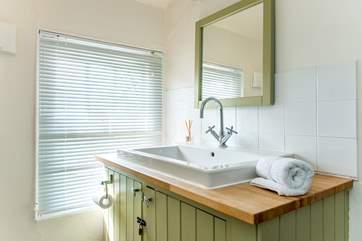 The family bathroom which has a fitted shower.