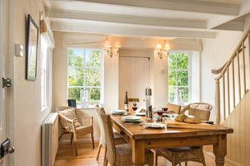 The dining area sits at one end of the open plan living room.