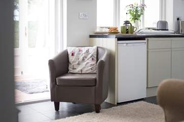 The sitting-area leads out to a lovely sun-room.