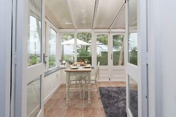 The living-area leads to the sun-room.
