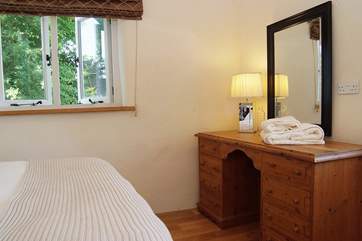 The bedroom is nicely styled.