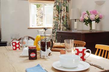 The dining-table has enough room for friends to come and dine!
