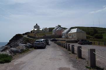 The beach car park and approach lane to the property.