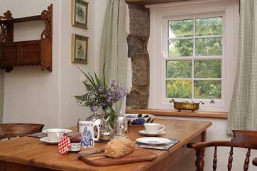 A large dining-table provides the setting for a romantic meal.