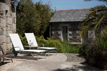 The terrace at Nansbara is set across the pond from Marbles (3267), a new property on the site.