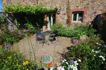 The delightful private garden at the back of Ostler's Cottage.