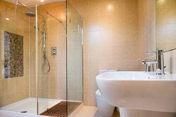 The en suite is simply stunning and the walk in shower has a drench shower head.