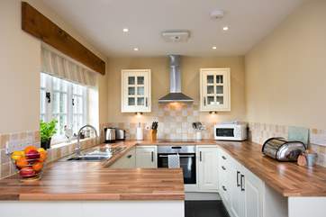 The kitchen is light and airy and well-equipped.